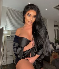 Escort Ambee with brunette hair